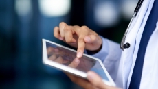 Healthcare provider on a tablet