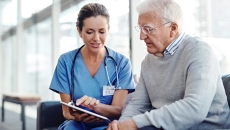 Older patient speaking with healthcare professional Older patient speaking with healthcare professional
