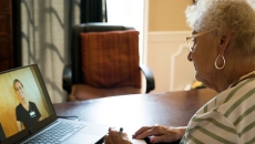 A person talking to a provider via a video call.
