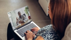 Person on a telehealth call on their laptop