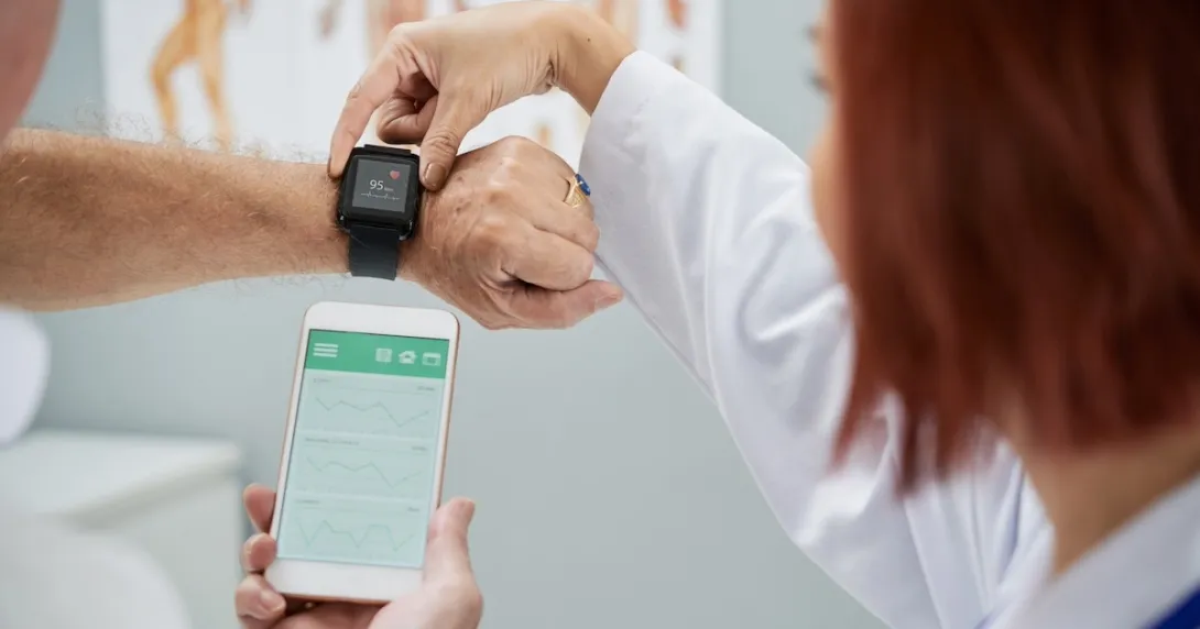 Healthcare professional explaining smart watch and smart phone link