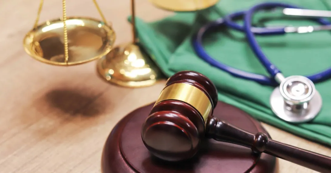 
  A gavel and a stethoscope. 
