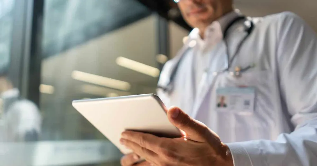 Doctor looking at tablet