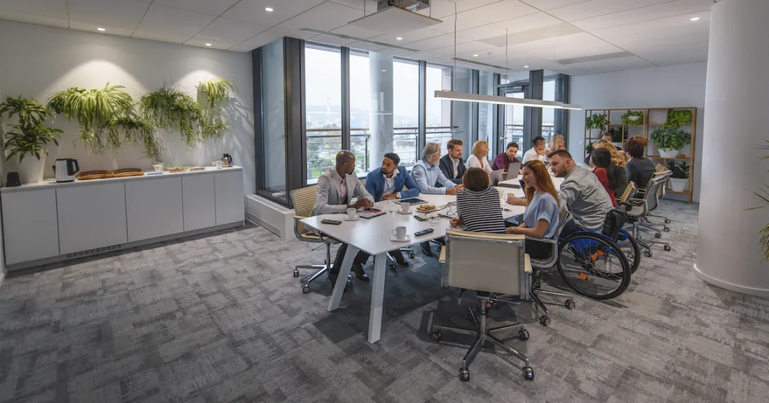 
  People sitting around a table in a conference room
