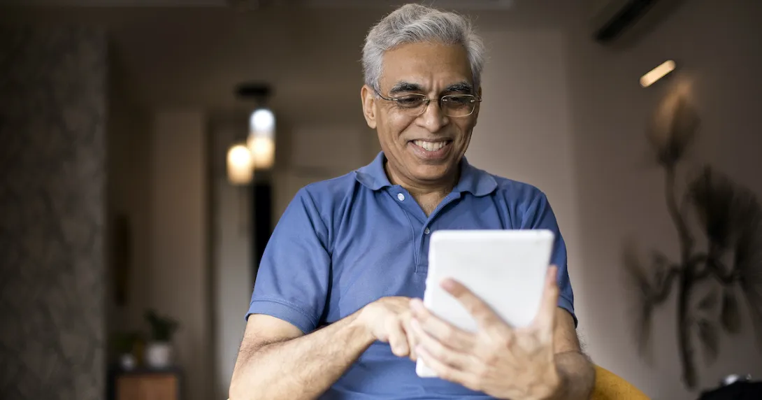 An elderly using a digital tablet