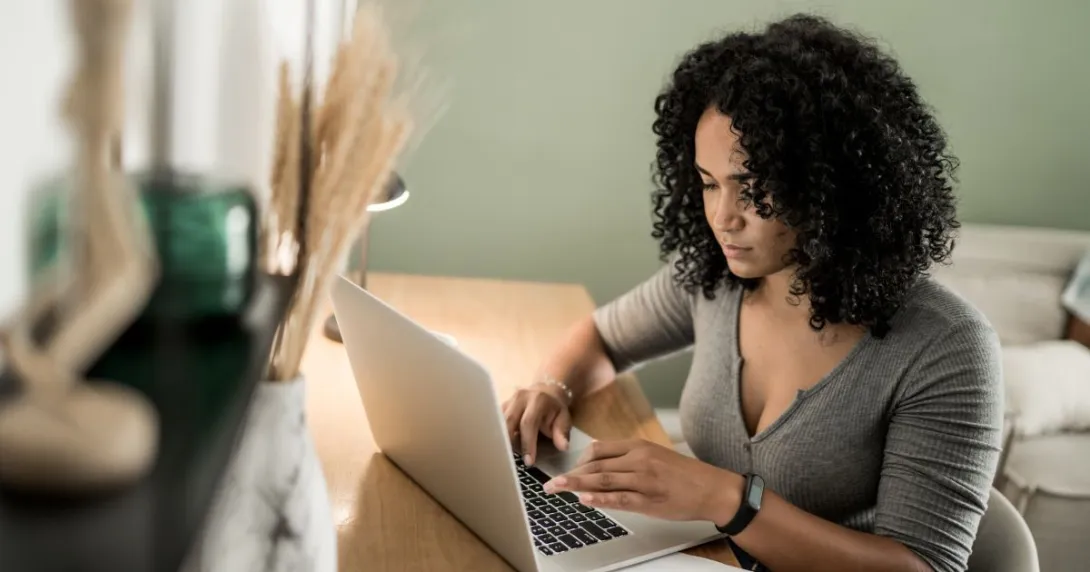 Person with computer at desk