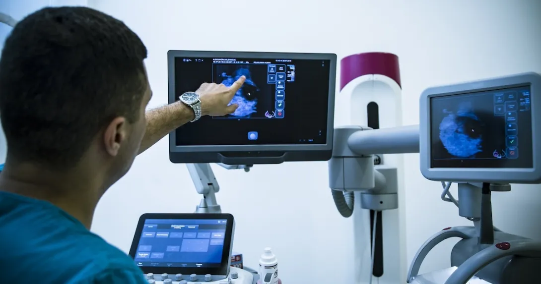 Technician looking at x-ray