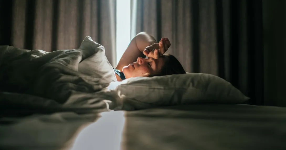 Person lying in bed