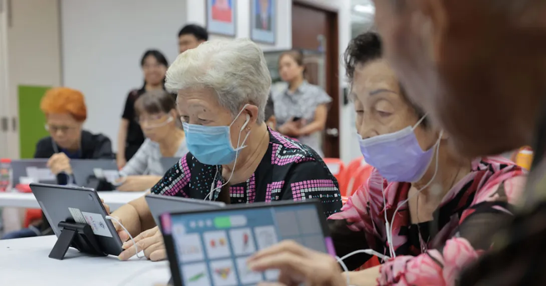 
  Seniors at Lions Befrienders playing the AMI app on their tablets
