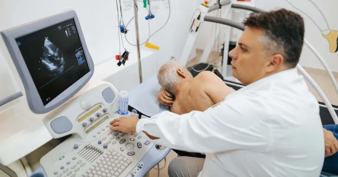 
  A doctor conducting a cardiac ultrasound.
