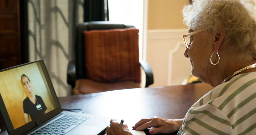 
  A person talking to a provider via a video chat on a laptop
