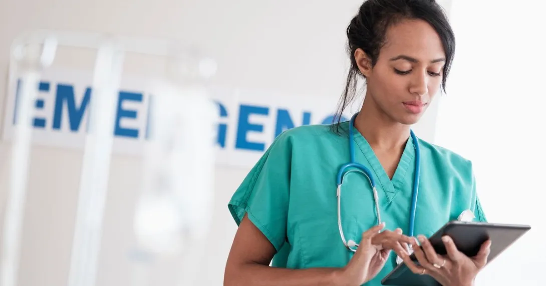 Healthcare provider looking at a tablet Healthcare provider looking at a tablet