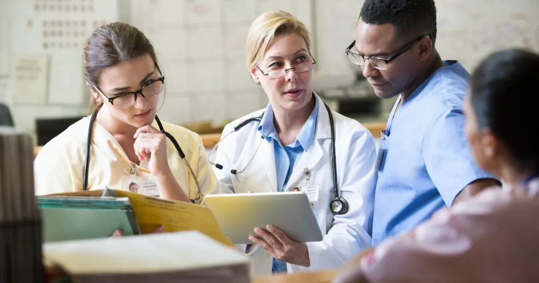 
  Healthcare professionals looking at a tablet
