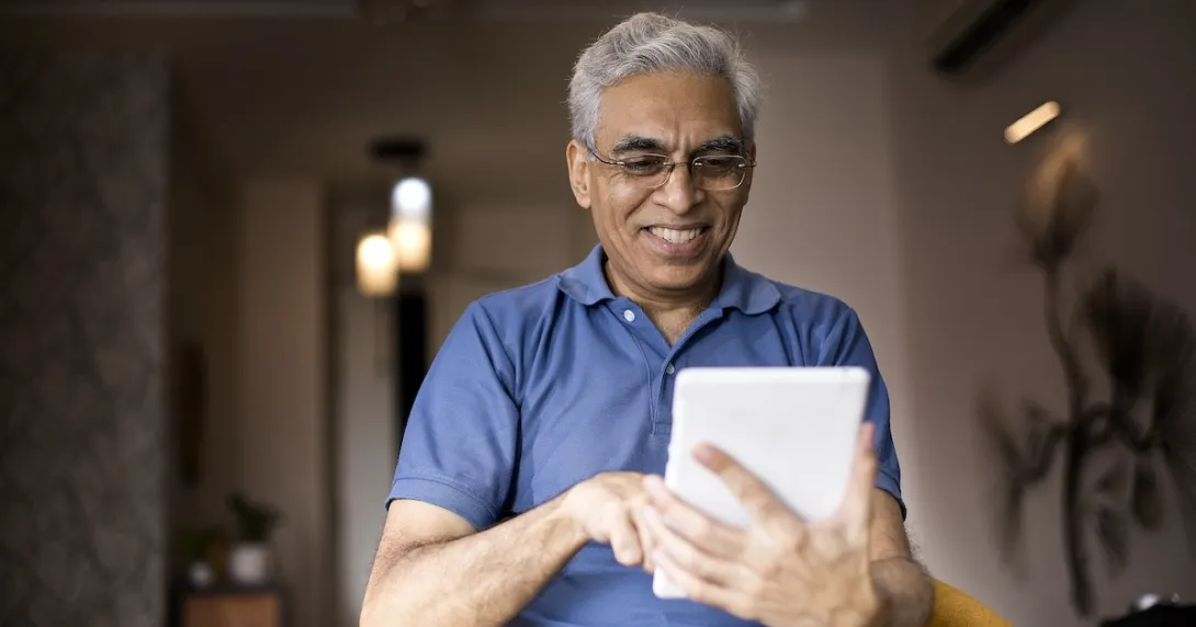 Man looking at tablet computer Man looking at tablet computer