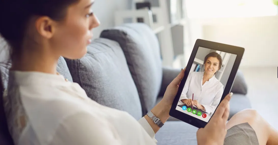 A person talking to a provider on her tablet