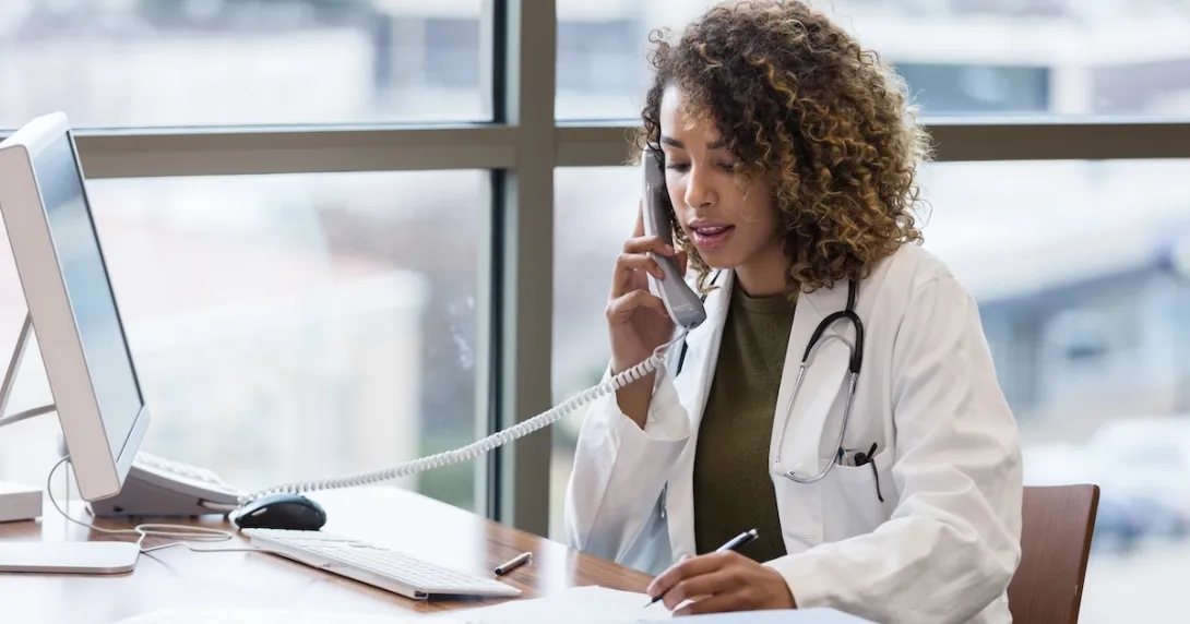 Healthcare professional talking to someone on the phone